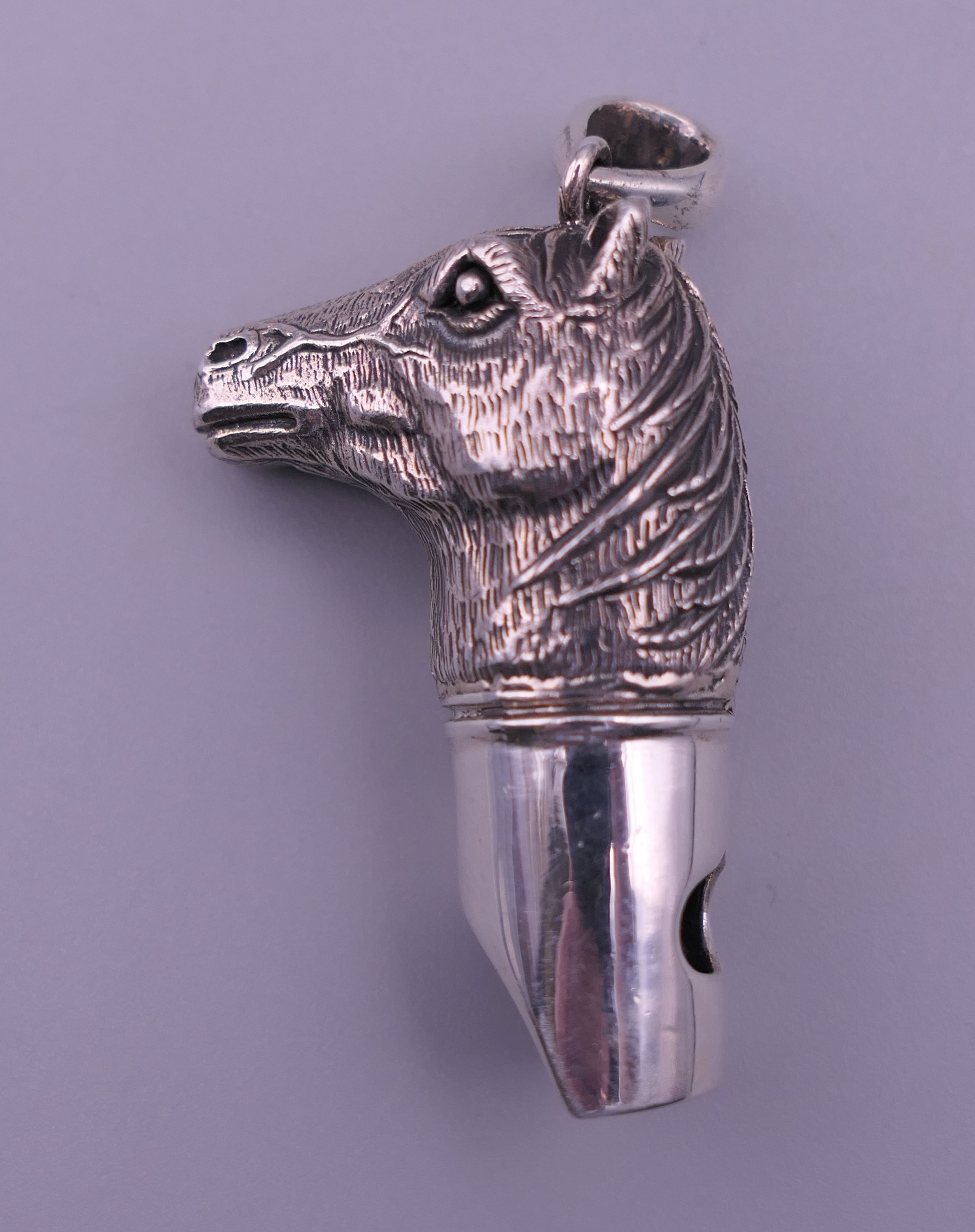 A 925 silver whistle in the form of a horse's head. 4 cm high excluding suspension loop. - Image 2 of 6