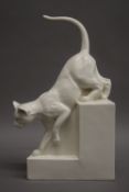 An Art pottery model of a cat, signed C.A.B. 34 cm high.