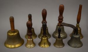 A box of various hand/school bells.