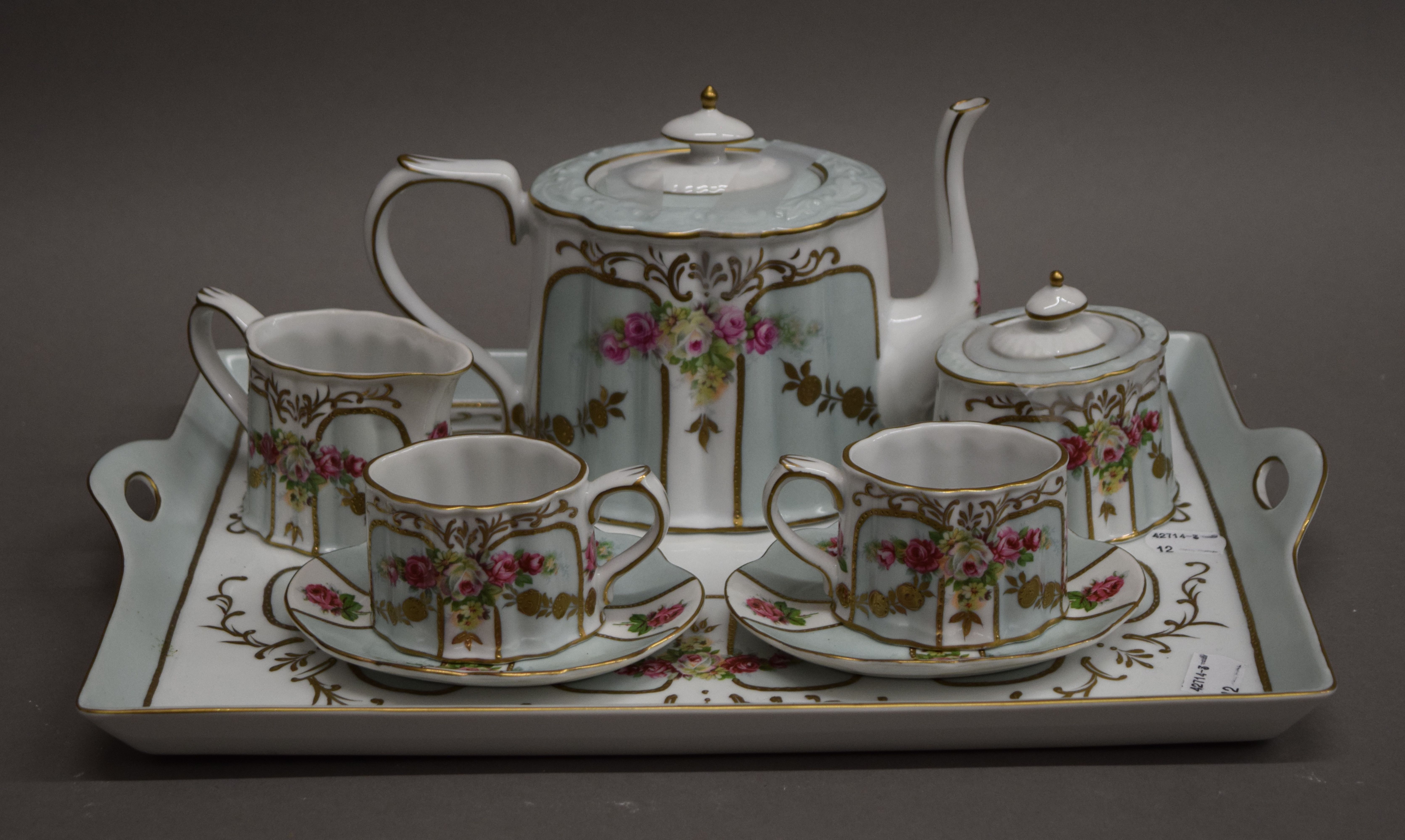 A Meander BV duet tea set on tray. The tray 39 cm long.