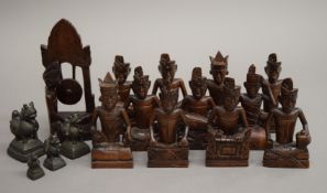 A quantity of Eastern carved figures and bronze weights. The largest 15 cm high.