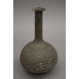 An antique Islamic bottle vase. 25 cm high.
