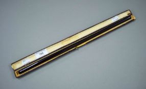 A large late 19th/early 20th century cigarette holder in leather case. The case 41.5 cm long.