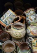A quantity of Glyn Colledge Denby jugs and tankards.