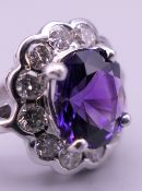 A 14 ct white gold amethyst and diamond ring. Approximately 0.65 carat of diamonds. Ring size M.