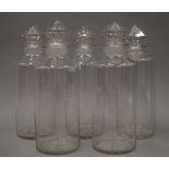 Five Victorian clear glass jars. Each approximately 31 cm high.
