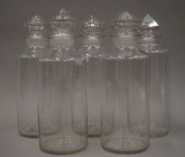 Five Victorian clear glass jars. Each approximately 31 cm high.