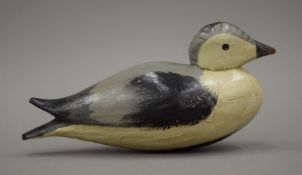 A decoy duck, possibly a smew. 27 cm long.