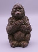 A small bronze model of a gorilla. 5 cm high.