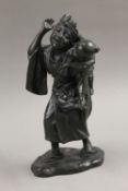 A Meiji Period Japanese bronze model of a girl and baby. 26 cm high.