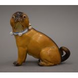 A 19th century Continental porcelain model of a pug dog. 10 cm high.