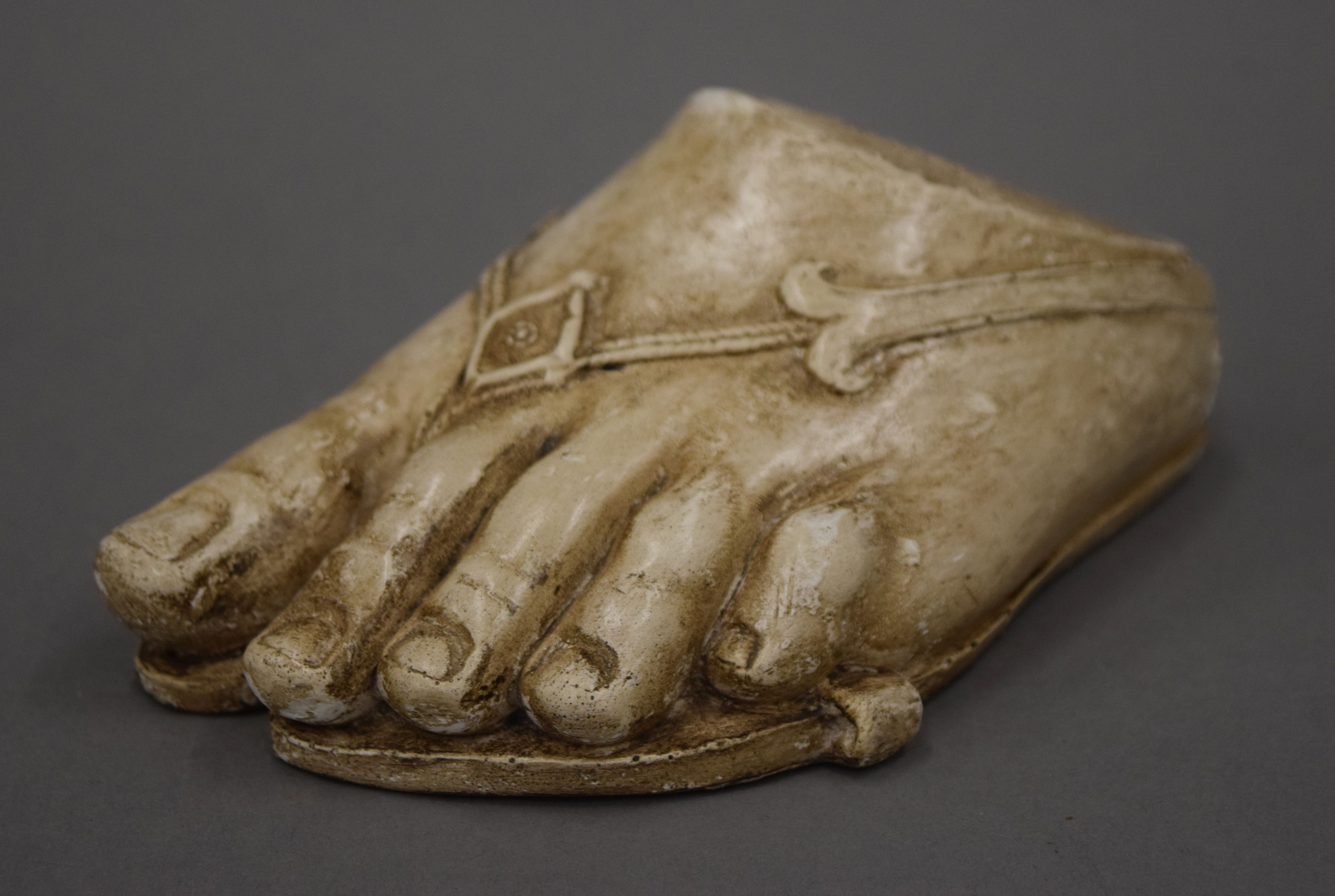 A plaster model of a foot. 16 cm long.