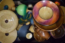 A collection of turned treen dishes, vases, etc.