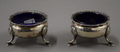 Two silver salts with blue glass liners. 7 cm diameter. 171.8 grammes.