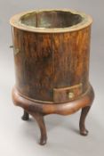 A wooden bucket. 48 cm high.