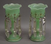 A small pair of Victorian green glass lustres. 22.5 cm high.