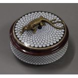 A porcelain and bronze box surmounted with a lizard. 13 cm diameter.