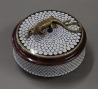 A porcelain and bronze box surmounted with a lizard. 13 cm diameter.