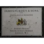 A sign for James Purdey and Sons Ltd, Gun and Rifle Makers, Audley House, South Audley Street,