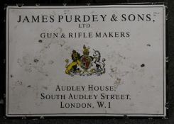 A sign for James Purdey and Sons Ltd, Gun and Rifle Makers, Audley House, South Audley Street,