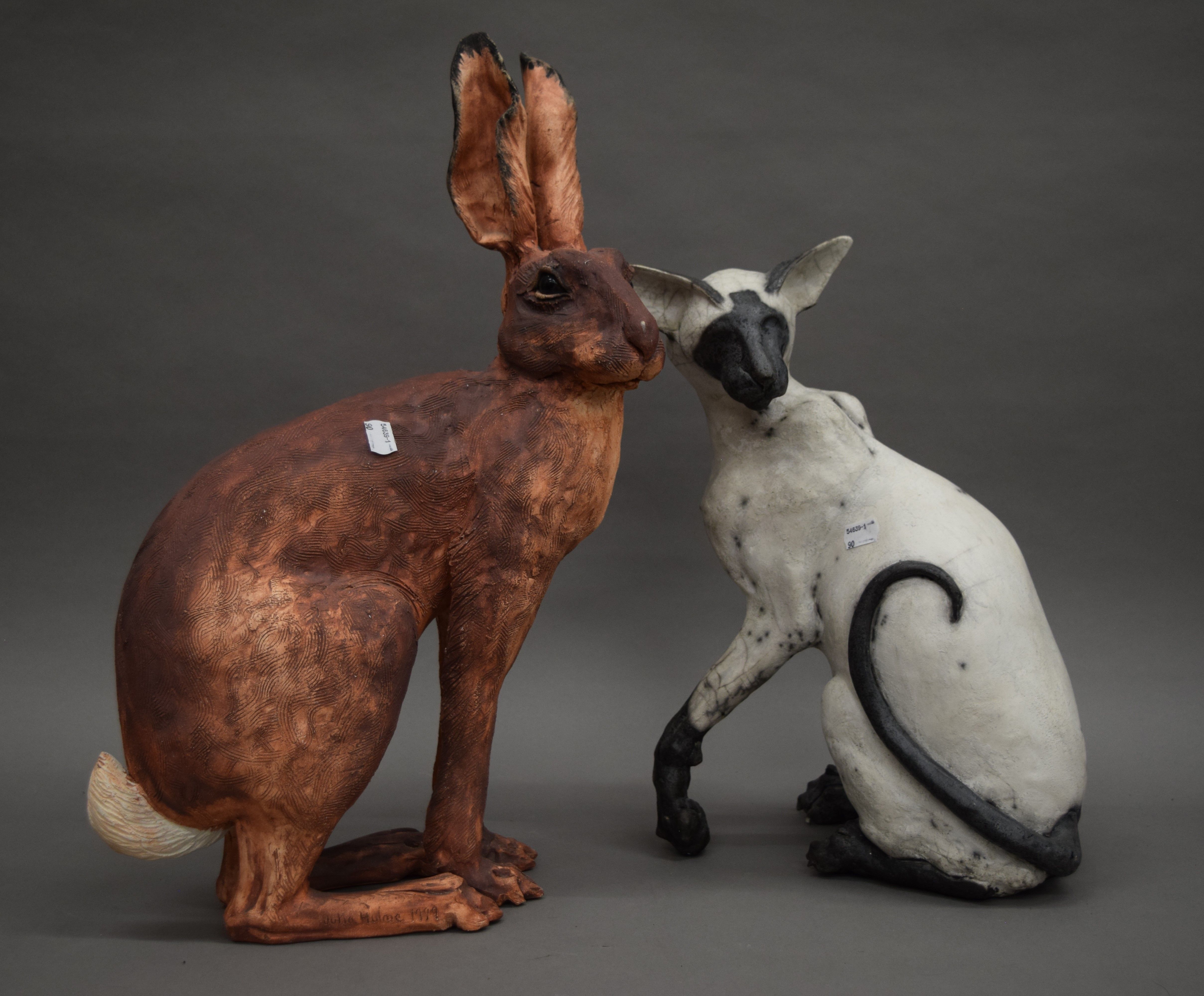 A Julia Hulme pottery model of hare and a pottery model of a cat. The former 53 cm high.