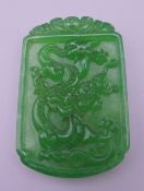 A jade dragon pendant. 5.5 cm high.