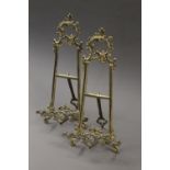 A pair of brass table easels. 41 cm high.