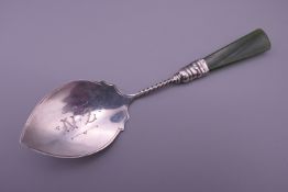A sterling silver jade handled spoon. 12.5 cm long.