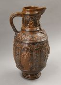 A 19th century brown glazed pottery jug. 45 cm high.