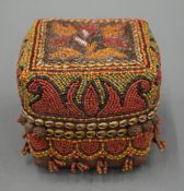 A Bamileke tribal beadwork box. 12 cm square.