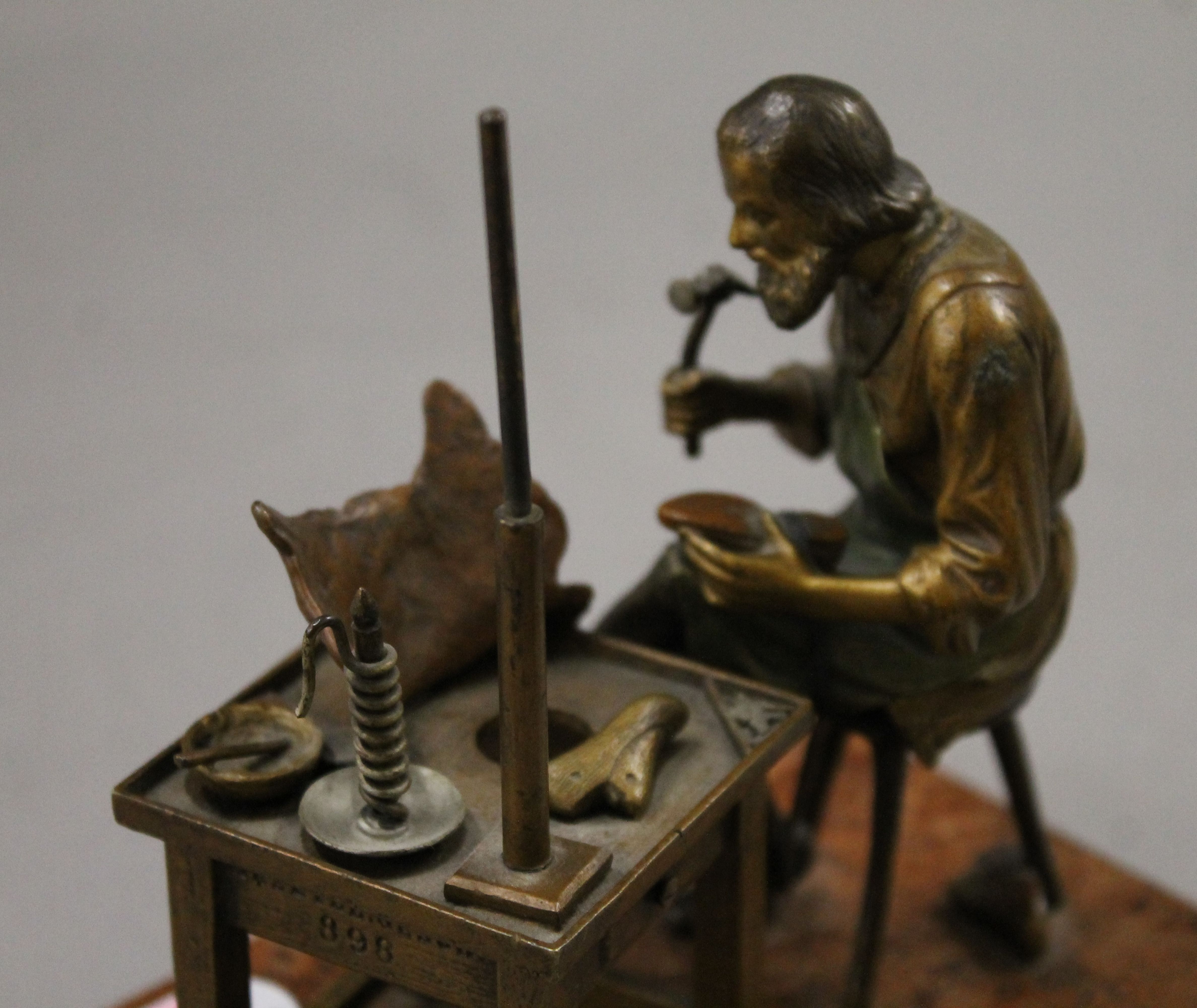 A cold painted bronze model of a cobbler mounted on a rouge marble base. 13.5 cm wide. - Image 6 of 6
