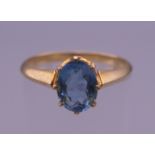 An 18 ct gold aquamarine ring. Ring size L. 2.4 grammes total weight.