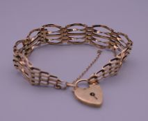 A 9 ct gold bracelet with padlock fastener. 16 cm long. 8.5 grammes.