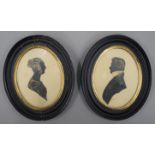 A pair of 19th century silhouettes, a man and a lady, each framed and glazed. 16 x 13 cm.