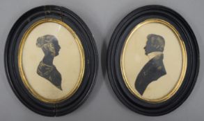 A pair of 19th century silhouettes, a man and a lady, each framed and glazed. 16 x 13 cm.