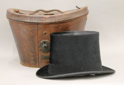 A Victorian top hat and leather case.