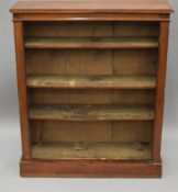 A Victorian walnut bookcase. 86 cm wide, 102 cm high.