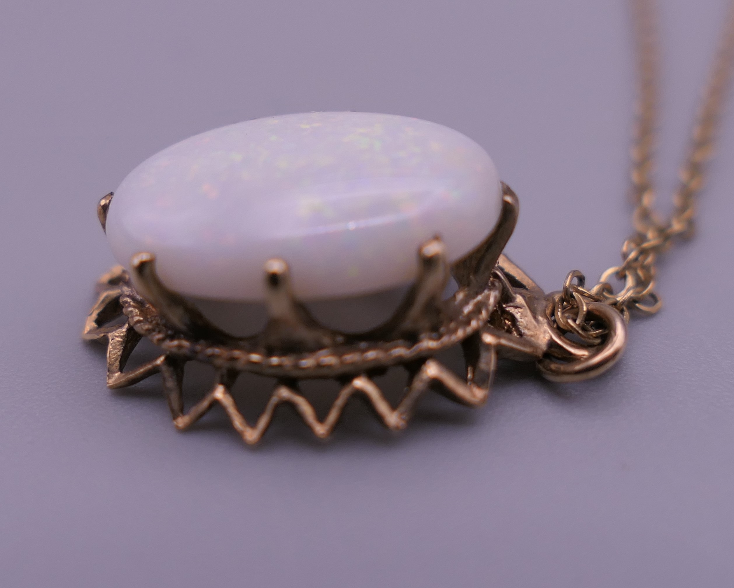 A 9 ct gold and opal pendant on chain. The pendant 2 cm high. 2.8 grammes total weight. - Image 2 of 7