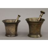 Two small 18th/19th century bronze pestle and mortars. The largest 11.5 cm high.