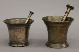 Two small 18th/19th century bronze pestle and mortars. The largest 11.5 cm high.