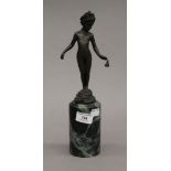 A bronze model of a young girl mounted on a marble plinth base. 32 cm high.
