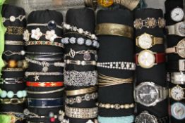 A quantity of various watches, bracelets and hat pins.