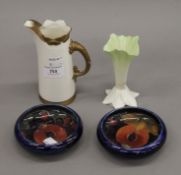 Two Moorcroft dishes, a Worcester vase and a Worcester ewer. The latter 15 cm high.