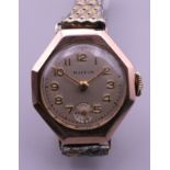 A vintage 9 ct rose gold ladies Mappin wristwatch on a gold plated strap, in working order.