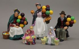 Three Royal Doulton balloon figures and two miniature figurines. The largest 22 cm high.