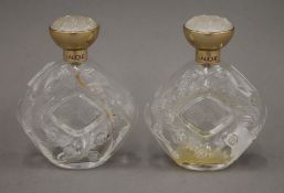 Two Lalique glass perfume bottles. 11 cm high.