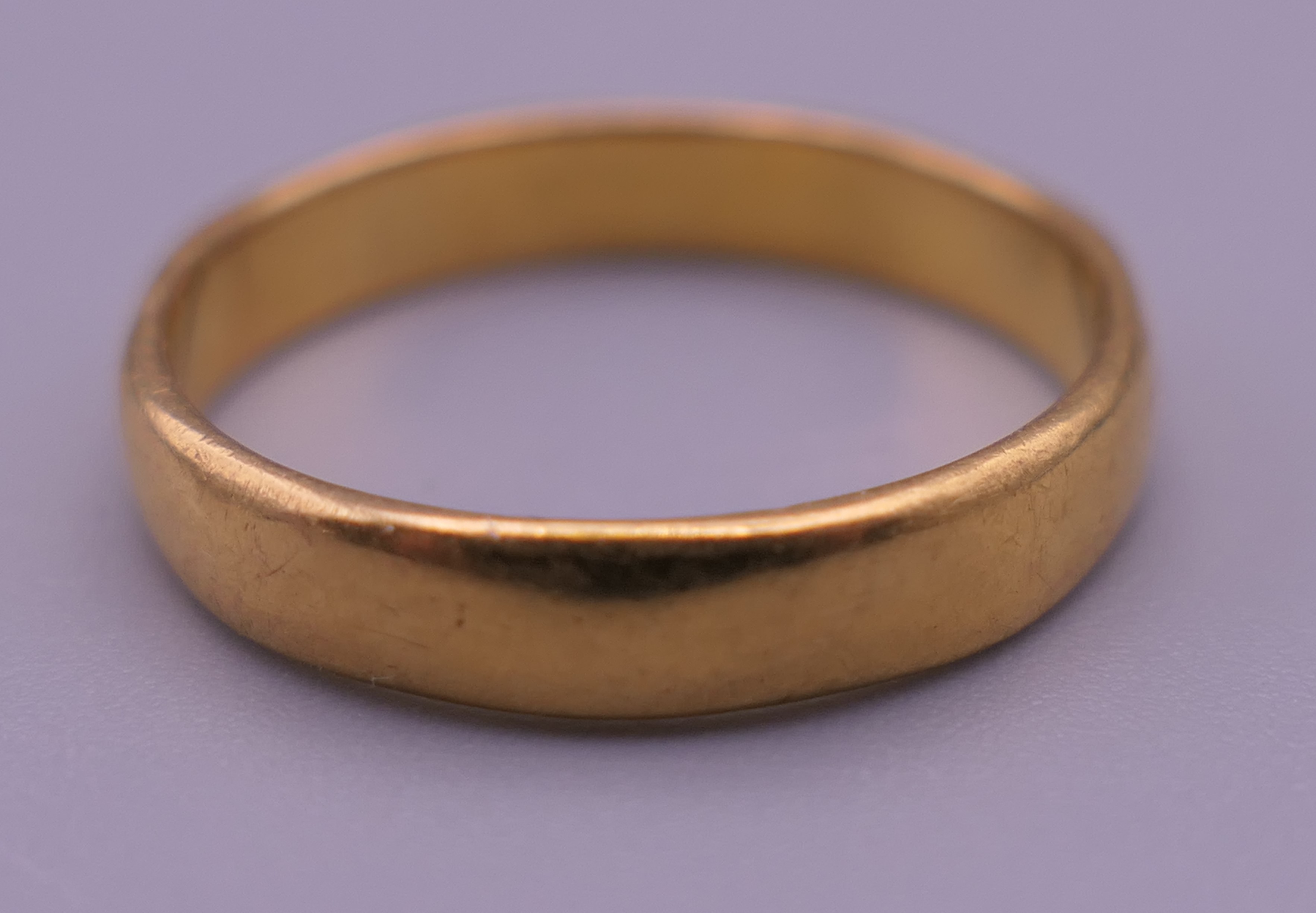 A 22 ct gold wedding band. Ring size N/O. 3.6 grammes. - Image 3 of 4