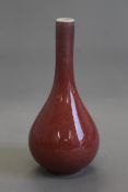 A small Chinese red porcelain straight neck vase. 14.5 cm high.