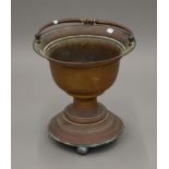 A 19th century copper bucket of waisted form. 37 cm high excluding handle.