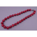 A coral bead necklace. 48 cm long.